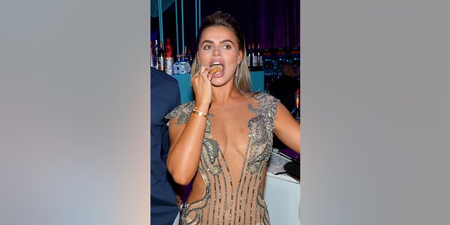 Brooks Nader visits the Popeyes Nuggets activation at the Sports Illustrated Swimsuit Party in Hollywood, Florida.