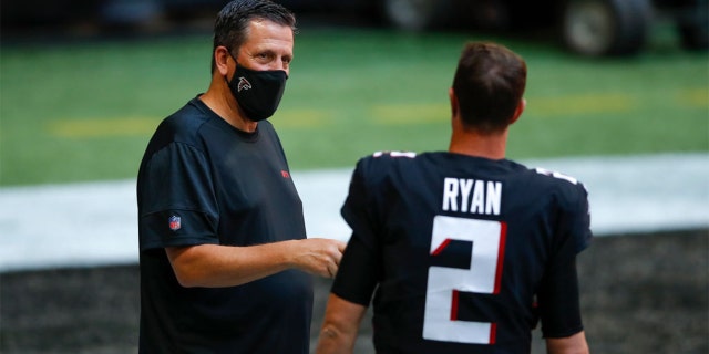 SEPTEMBER 27: Matt Ryan #2 of the Atlanta Falcons speaks with quarterbacks coach Greg Knapp prior to an NFL game against the Chicago Bears at Mercedes-Benz Stadium on September 27, 2020 in Atlanta, Georgia. (Photo by Todd Kirkland/Getty Images)