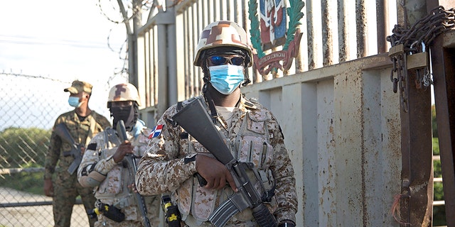 Soldiers guard the Dajabon border crossing between the Dominican Republic and Haiti after the borders were closed due to the assassination perpetrated by an armed group against the president of Haiti, Jovenel Moise, in the early hours of Wednesday, July 7, 2021. (Photo by Erika SANTELICES / AFP) (Photo by ERIKA SANTELICES/afp/AFP via Getty Images)