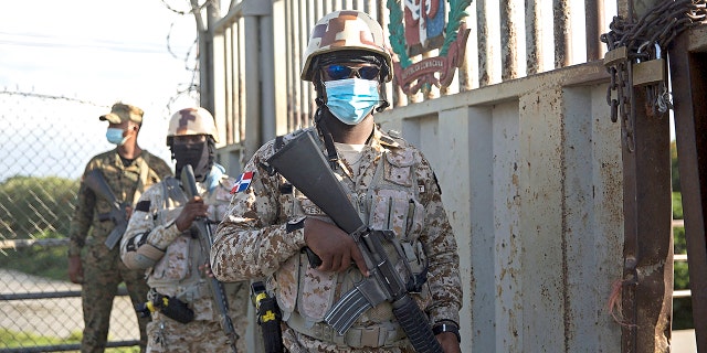 Soldiers guard the Dajabon border crossing between the Dominican Republic and Haiti after the borders were closed due to the assassination perpetrated by an armed group against the president of Haiti, Jovenel Moise, in the early hours of Wednesday, July 7, 2021. (Photo by Erika SANTELICES / AFP) (Photo by ERIKA SANTELICES/afp/AFP via Getty Images)