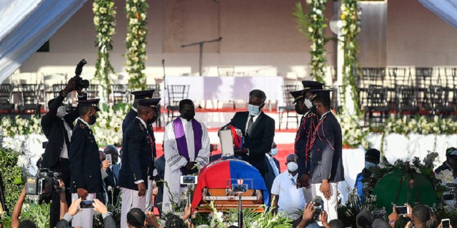 The funeral is held for slain Haitian President Jovenel Moise at his family home in Cap-Haitien, Haiti, on Friday, July 23. Moise was assassinated at his home in Port-au-Prince on July 7.