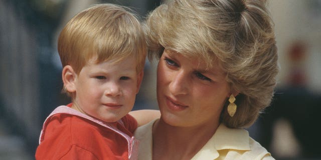 Diana, Princess of Wales with her son Prince Harry during a holiday with the Spanish royal family at the Marivent Palace in Palma de Mallorca, Spain, August 1987.