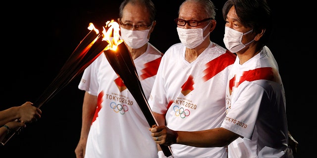 Shigeo Nagashima, Hideki Matsui and Sadaharu Oh carry the olympic flame during the Opening Ceremony of the Tokyo 2020 Olympic Games at Olympic Stadium on July 23, 2021 in Tokyo, Japan. (Photo by Maddie Meyer/Getty Images)