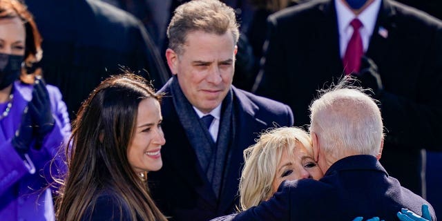 WASHINGTON, DC - JANUARY 20: U.S. President Joe Biden embraces his family First Lady Dr. Jill Biden, son Hunter Biden and daughter Ashley after being sworn in during his inauguation on the West Front of the U.S. Capitol on January 20, 2021 in Washington, DC. During today's inauguration ceremony Joe Biden becomes the 46th president of the United States. (Photo by Drew Angerer/Getty Images)