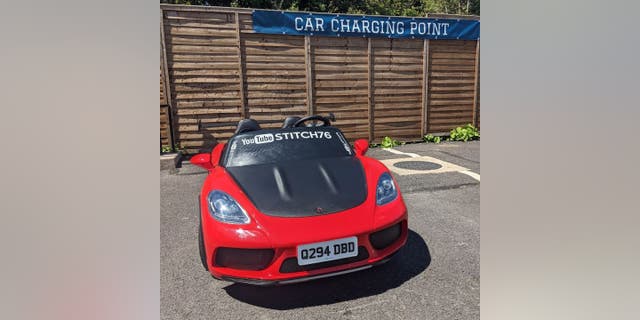 Scudder upgraded his family's red Super Sport XL ride-on car with with indicators, hazard lights, a horn and improved battery to comply with local road vehicle requirements.