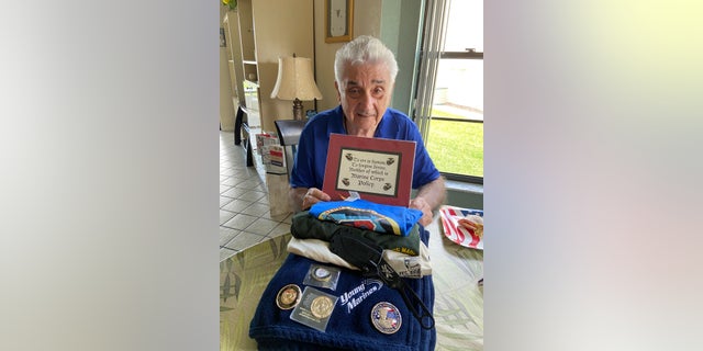 Peter V. Ruvolo with gifts presented to him from The Young Marines of the Palm Beaches.