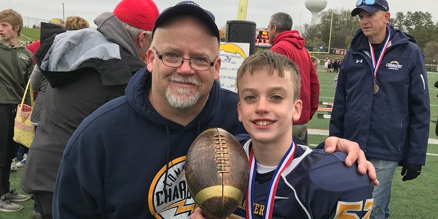 Dave Snook (right) and his 13-year-old son, Andrew "Andy" Snook. Andy was found underwater after going missing for 20 minutes on June 25 in a pond at a Petersberg, Michigan Kampgrounds of America camp. He's in critical condition at Cleveland Clinic Medical Center in Ohio.  