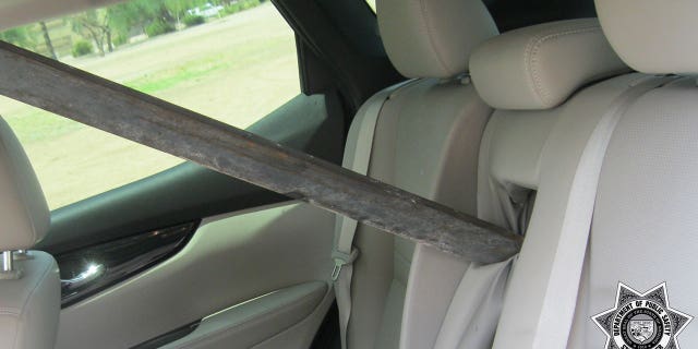 A metal pole is seen extending into the rear seat of Mandy Poff's vehicle. (Arizona Department of Public Safety)