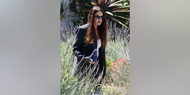 Janice Dickinson is seen for the first time since news broke that convicted sexual predator Bill Cosby had been released early from prison. The former model was dressed in black and had the support of her husband Robert Gerner as a limousine waited outside her Los Angeles home.