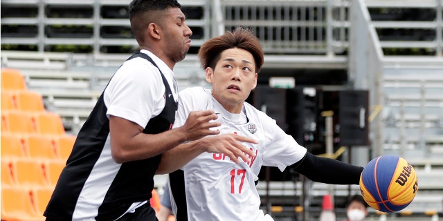 Soichiro Fujitaka (No. 17) in action in the men's semifinal match during the 3x3 Basketball Olympic test event at the Aomi Urban Sports Park on May 16, 2021, in Tokyo, Japan. (Kiyoshi Ota/Getty Images)