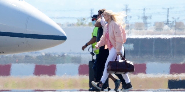 Erika Jayne was spotted boarding a private jet despite her mounting legal and financial troubles.