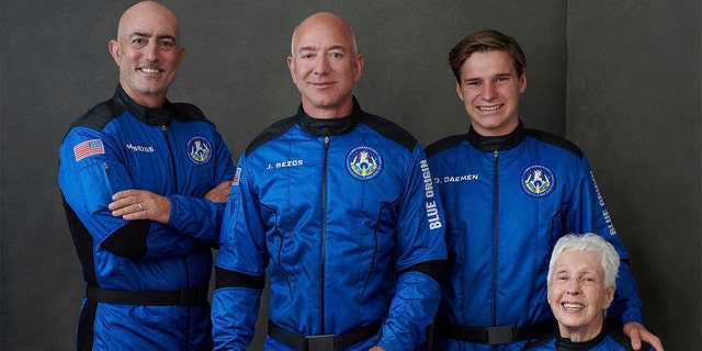In this photo provided by Blue Origin, from left to right: Mark Bezos, brother of Jeff Bezos; Jeff Bezos, founder of Amazon and space tourism company Blue Origin; Oliver Daemen, of the Netherlands; and Wally Funk, aviation pioneer from Texas, pose for a photo.