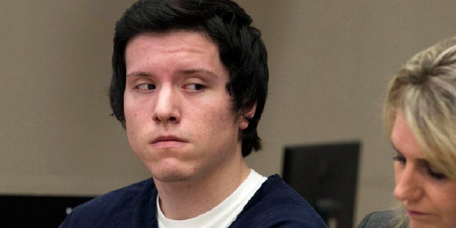 In this Sept. 19, 2019 file photo defendant John Earnest listens during testimony by a witness during a preliminary hearing in Superior Court in San Diego. Earnest pleaded guilty Tuesday, July 20, 2021, to murder and other charges in connection with a deadly shooting at a Southern California synagogue on the last day of Passover.