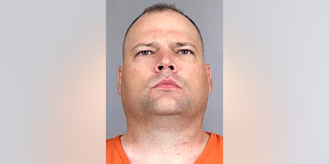 This undated photo provided by the Aurora Police Department shows Colorado police officer John Haubert who was arrested after he allegedly beat a man with his pistol, choked him and threatened to kill him while attempting an arrest on Friday, July 23, 2021. (Aurora Police Department via AP)