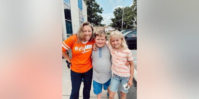 Grady Witkowski (middle), his Liquid Church buddy Katy Herridge (left) and his sister June Witkowski (right) pose arm-in-arm at the contemporary church they all enjoy in Parsippany, N.J.