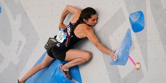 The United States' Kyra Condie climbs during women's boulder qualification at the climbing World Cup on May 21, 2021, in Salt Lake City, Utah. (AP Photo/Rick Bowmer, File)