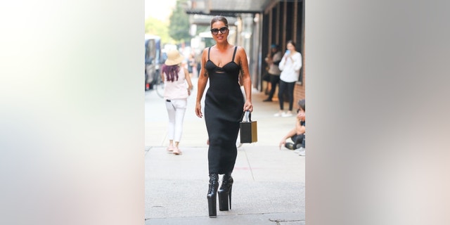 Lady Gaga stunned in a black dress and high platform heels as she emerged from the studio in New York.
