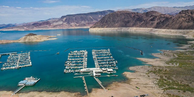 Lake Mead, NV - June 28: An aerial view of droughts effect at Hemenway Harbor, Lake Mead, which is at its lowest level in history since it was filled 85 years ago, Monday, June 28, 2021. The ongoing drought has made a severe impact on Lake Mead and a milestone in the Colorado River's crisis. High temperatures, increased contractual demands for water and diminishing supply are shrinking the flow into Lake Mead. Lake Mead is the largest reservoir in the U.S., stretching 112 miles long, a shoreline of 759 miles, a total capacity of 28,255,000 acre-feet, and a maximum depth of 532 feet. (Allen J. Schaben / Los Angeles Times via Getty Images)