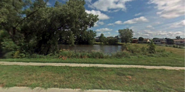 The pond in Lincoln, Neb., where the boy was spotted drowning.