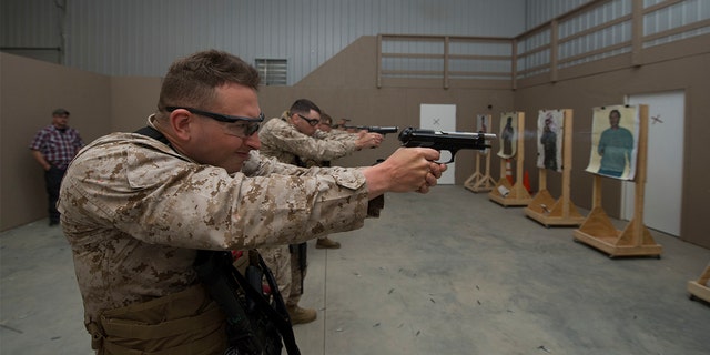 U.S. Marines attached to the Marine Security Augment Unit (MSAU) practice firing on stationary targets in Summit Point, W.Va., April 9, 2015. The training prepares members of MSAU for the protection and security of American Embassies and assets across the globe. (U.S. Marine Corps photo by Cpl. Daniel Benedict/Released)