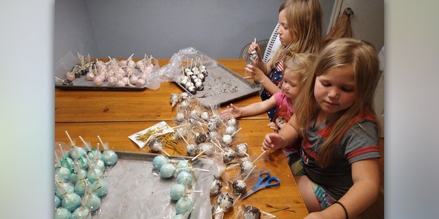 Madsen's daughters' preparing cake pops for the lemonade stand. 