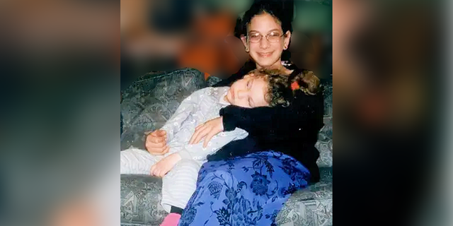 Malki Roth with her youngest sister, Haya, who is severely disabled. 