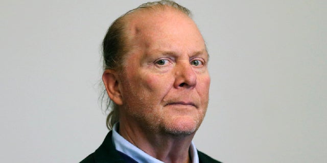 In this May 2019, file photo, celebrity chef Mario Batali is arraigned on a charge of indecent assault and battery in Boston Municipal Court in Boston, in  connection with a 2017 incident at a Boston restaurant.