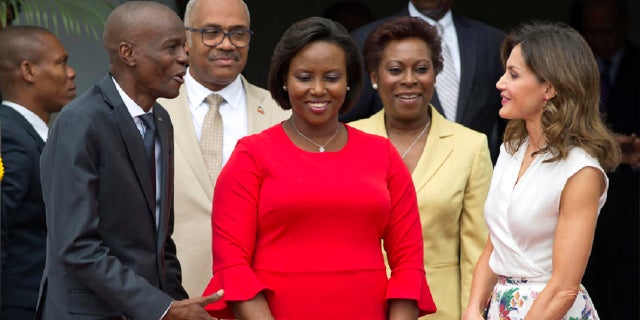 In this May 23, 2018, file photo, Assasinated President Jovenel Moise, left, and former First Lady Martine Moise, in red, receive Spain's Queen Letizia Ortiz at the national Palace in Port-au-Prince, Haiti, Wednesday, May 23, 2018. (AP)