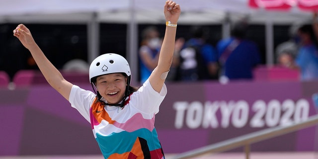 Momiji Nishiya of Japan reacts after winning the women's street skateboarding finals at the 2020 Summer Olympics, Monday, July 26, 2021, in Tokyo, Japan. (AP Photo/Ben Curtis)