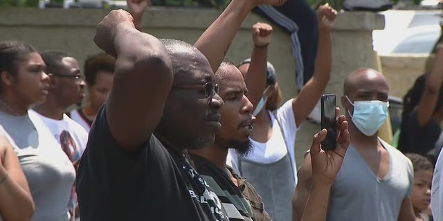 The number of protesters grew to about 100 on Monday.