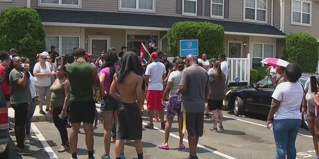 Protesters outside a home in Mt. Laurel, N.J.