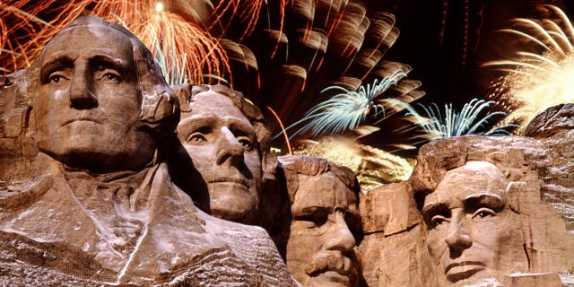 Mt. Rushmore in South Dakota, with fireworks in the background.  