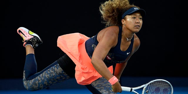 Japan's Naomi Osaka serves to the United States' Jennifer Brady during the women's singles final at the Australian Open tennis championship in Melbourne, Australia, in this Saturday, Feb. 20, 2021. (AP Photo/Andy Brownbill, File)