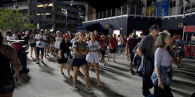 Spectators leave Nationals Park after an incident near the ballpark during the sixth inning of a baseball game between the Washington Nationals and the San Diego Padres, Saturday, July 17, 2021, in Washington.  (Associated Press)