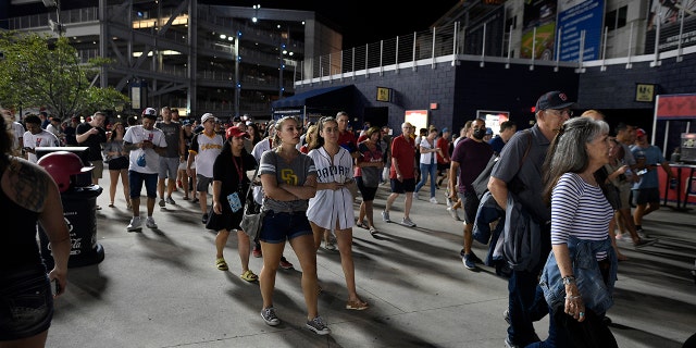 Spectators leave Nationals Park after an incident near the ballpark during the sixth inning of a baseball game between the Washington Nationals and the San Diego Padres, Saturday, July 17, 2021, in Washington. (Associated Press)