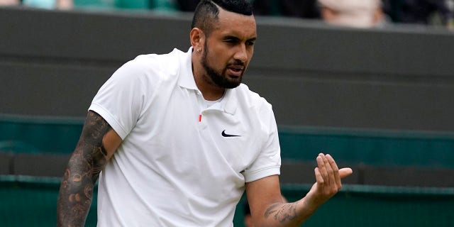 Australia's Nick Kyrgios gestures during the men's singles third round match against Canada's Felix Auger-Aliassime on day six of the Wimbledon Tennis Championships in London, Saturday July 3, 2021.