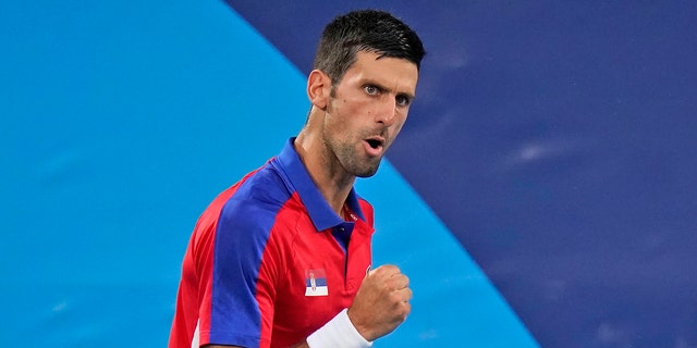 Novak Djokovic, of Serbia, reacts while playing Kei Nishikori, of Japan, during the quarterfinals of the tennis competition at the 2020 Summer Olympics, Thursday, July 29, 2021, in Tokyo.