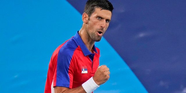 Novak Djokovic, of Serbia, reacts while playing Kei Nishikori, of Japan, during the quarterfinals of the tennis competition at the 2020 Summer Olympics, Thursday, July 29, 2021, in Tokyo, Japan.