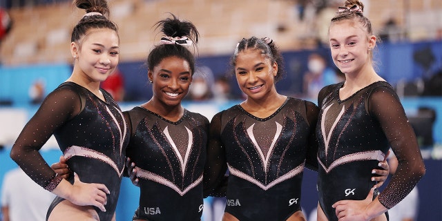 Sunisa Lee, Simone Biles, Jordan Chiles and Grace McCallum of Team USA pose for a photo during women's podium training ahead of the Tokyo 2020 Summer Olympics on on July 22, 2021. They sported black and white leotards that were embellished with rhinstones at the Ariake Gymnastics Centre in Tokyo, Japan. 