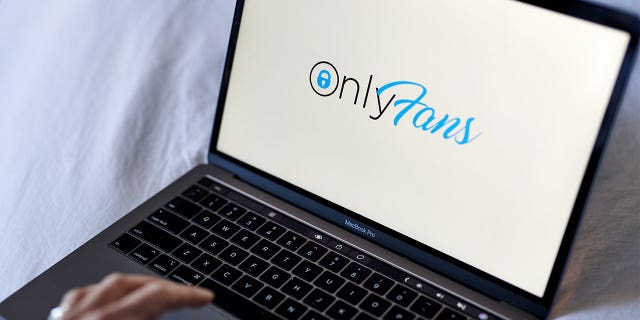 The OnlyFans logo on a laptop computer arranged in New York, U.S., on Thursday, June 17, 2021. OnlyFans, a site where celebrities and adult-film stars charge admirers for access to videos and photos, is in talks to raise new funding at a company valuation of more than $1 billion, according to people with knowledge of the matter. Photographer: Gabby Jones/Bloomberg via Getty Images