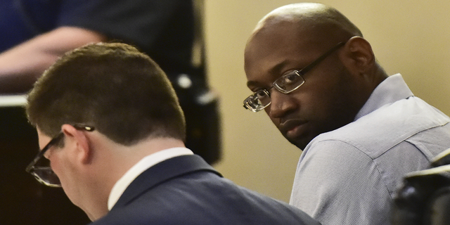 Murder defendant Otis McKane looks around the 379th District Court in San Antonio during his capital murder trial in the shooting death of San Antonio Police Dept. officer Benjamin Marconi on Monday. (AP/The San Antonio Express-News)