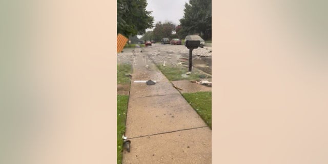 Debris is littered all over a residential street in the Dallas suburb of Plano after a reported explosion Monday.