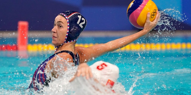 Nadezhda Glyzina (12), of the Russian Olympic Committee, shoots during a preliminary round women's water polo match against China at the 2020 Summer Olympics, Saturday, July 24, 2021, in Tokyo, Japan. (AP Photo/Mark Humphrey)