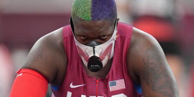 Raven Saunders of the United States rests during throws of the qualification rounds of the women's shot put at the 2020 Summer Olympics, Friday, July 30, 2021, in Tokyo. (AP Photo/Matthias Schrader)