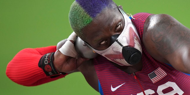 Raven Saunders of the United States competes in the qualification rounds of the women's shot put at the 2020 Summer Olympics, Friday, July 30, 2021, in Tokyo.