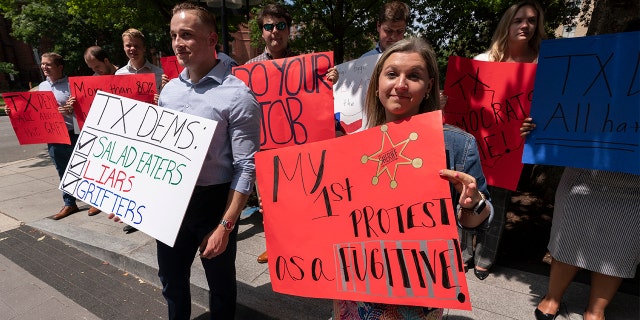 Representatives of the Republican National Committee gathered in front of the Washington Hotel on Wednesday, July 14, 2021, where Texas lawmakers are holding a press conference. (AP Photo / Manuel Balce Ceneta)