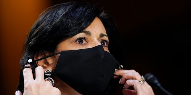 Dr.  Rochelle Walensky, director of the Center for Disease Control and Prevention, adjusts her face mask during a Senate Health, Education, Labor and Pensions Committee on the Federal Response to the Coronavirus on Capitol Hill in Washington, Thursday, March 18, 2021, file photo . 