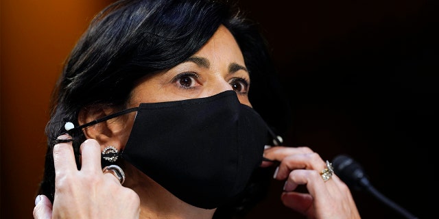 Dr. Rochelle Walensky, director of the Centers for Disease Control and Prevention, adjusts her face mask during a Senate Health, Education, Labor and Pensions Committee hearing on the federal coronavirus response on Capitol Hill in Washington, in this Thursday, March 18, 2021, file photo. 