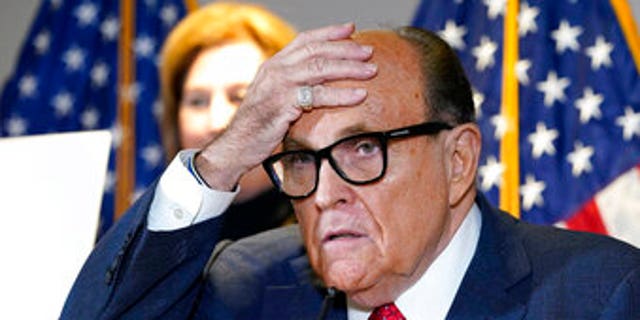 In this Nov. 19, 2020, file photo, former New York Mayor Rudy Giuliani, a lawyer for then-President Donald Trump, speaks during a news conference at the Republican National Committee headquarters in Washington. (AP Photo/Jacquelyn Martin)
