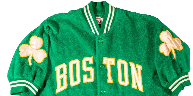 This photo provided by Hunt Auctions, shows a Boston Celtics NBA basketball jacket owned by Celtics player and coach, Bill Russell. (Mike Freeberg/Hunt Auctions via AP)